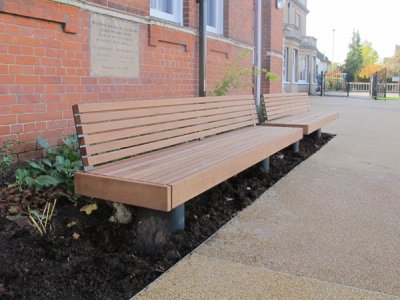 Elements 2.4m seat with small timber slats, timber fascias, and powder coated steel post supports (ELES212T7777-4651KNG)